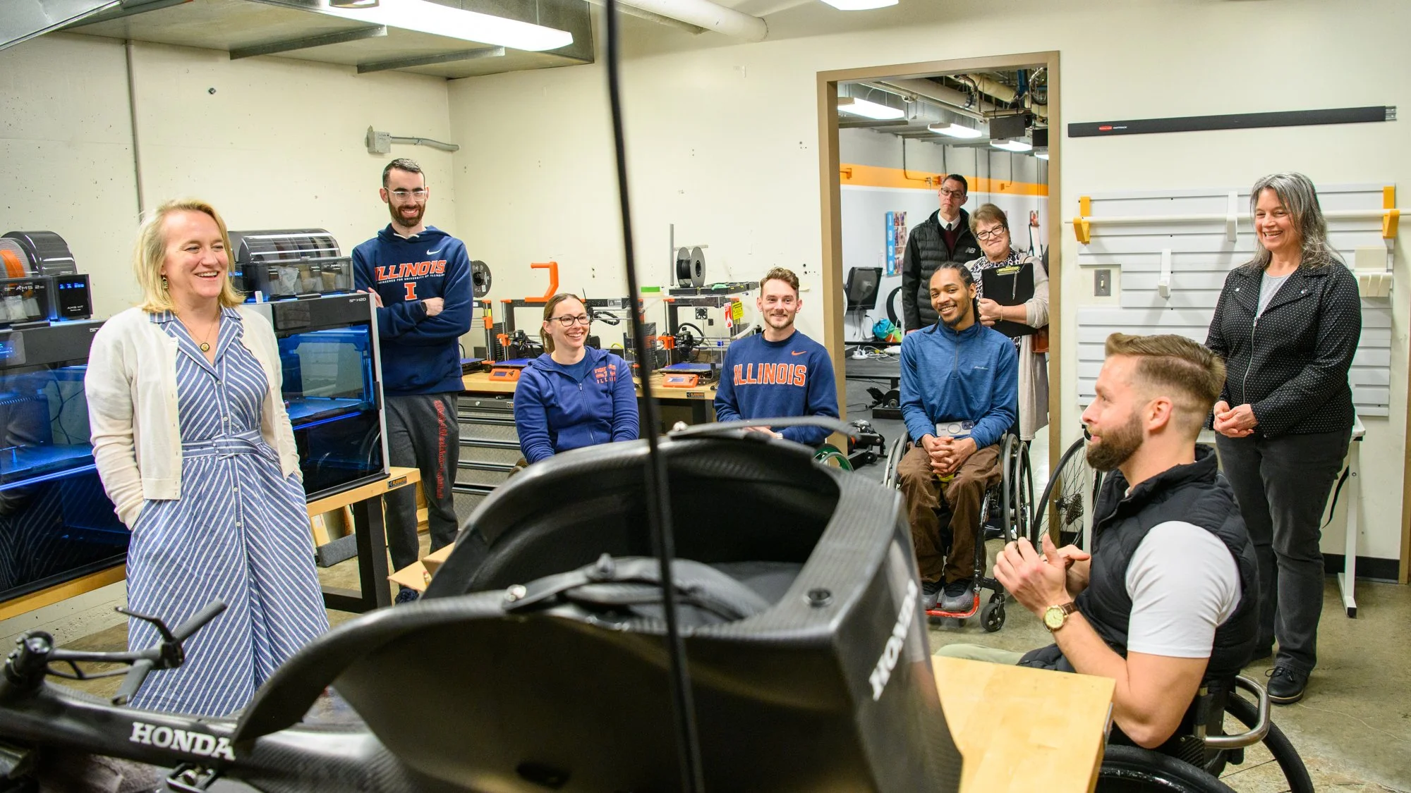 Rep. Nikki Budzinski (IL-13) visits the basement of Disability Resources and Educational Services at the University of Illinois. Coaches and athletes from its world-renowned wheelchair athletics program gave Rep. Budzinski a guided tour on April 6, 2