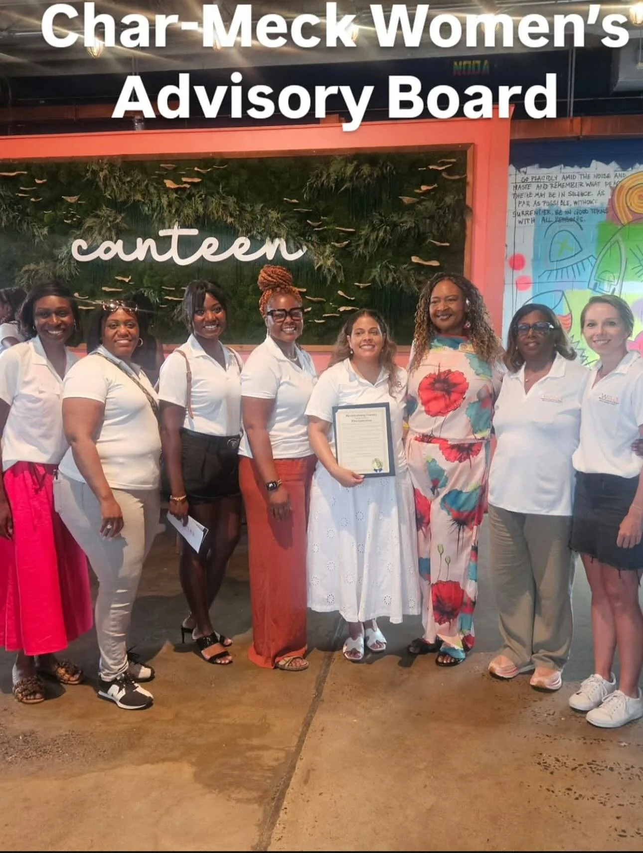 Mecklenburg County's Women's Advisory Board receives a Women's Equality Day Proclamation from the Board of County Commissioners