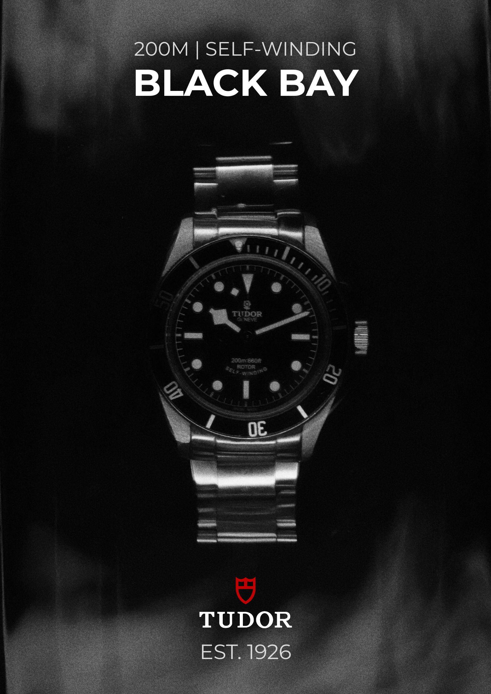 A black and white advertisement for a Tudor watch, featuring a close-up of the watch with a stainless steel strap and a black dial. The text indicates it is a 200-meter self-winding model called Black Bay, established in 1926.