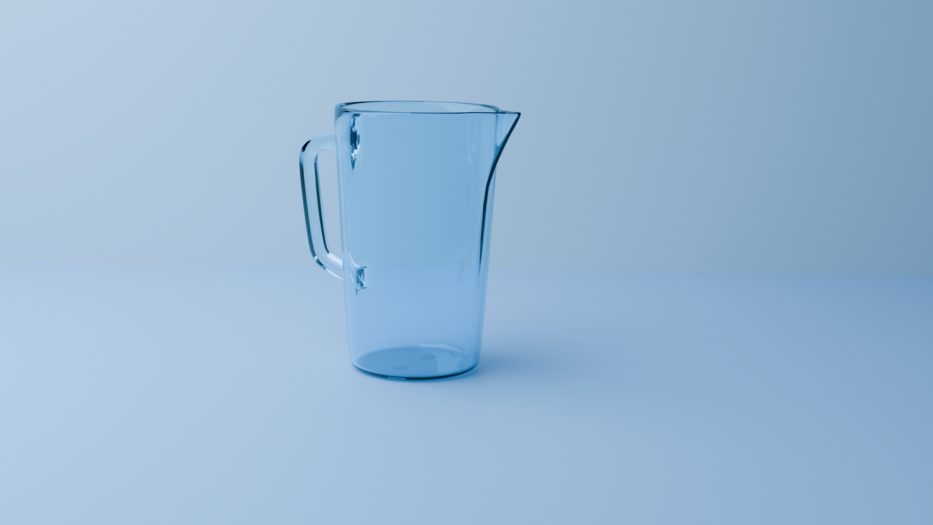 Transparent blue glass pitcher on a light blue surface and background.