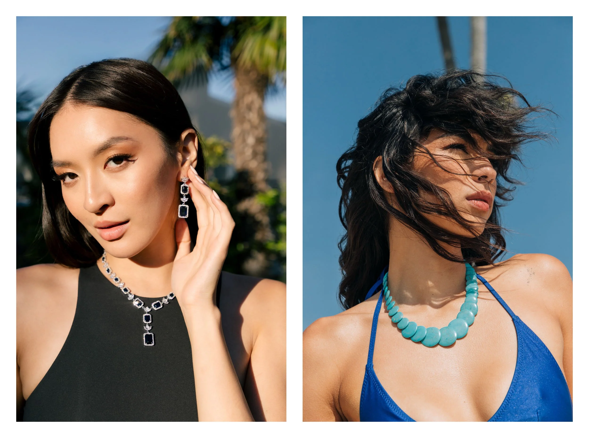 Two women outdoors, one on the left in a black dress with jewelry and the other on the right in a blue dress with a necklace, both with styled hair and a blue sky background.