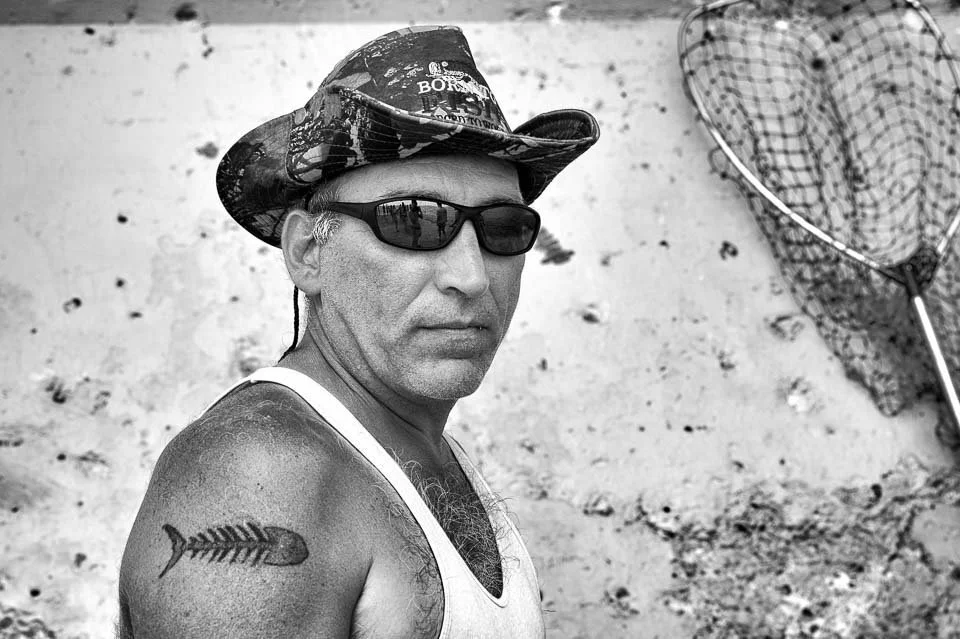 [29/100] Ron - We headed out to Grand Haven for the day to check out the art fair and to spend some time at the beach. Ron was fishing at the end of the pier. He reported that, unfortunately, he had lost three steelhead to snapped leaders so far, on 