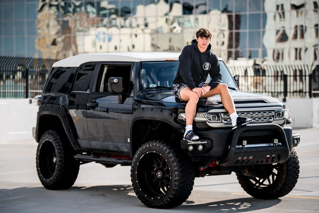 grand-rapids-senior-portrait-fj-cruiser-hood-downtown.jpg