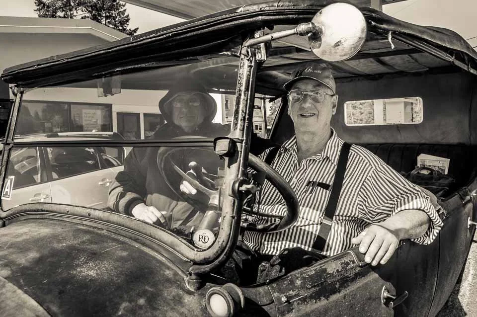 [24/100] Dan - My family headed down to Fennville to pick apples today (well, so we thought - no apples to be had!). On the way we needed to stop for cash and pulled in to this Shell station. As I got out of the van, Dan and Tom pulled in driving wha