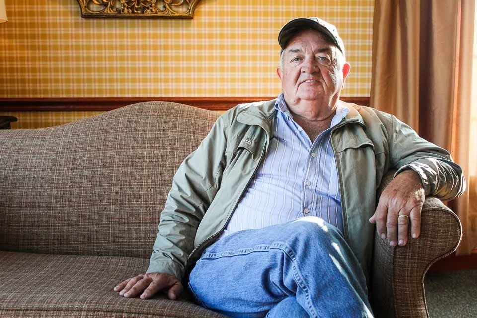 [1 of 100] Harold -My family met for dinner at Das Dutchman Essenhaus in Middlebury, Indiana. While we were waiting my eye kept drifting to this man, Harold, waiting for his wife. I introduced myself and he agreed to a portrait.