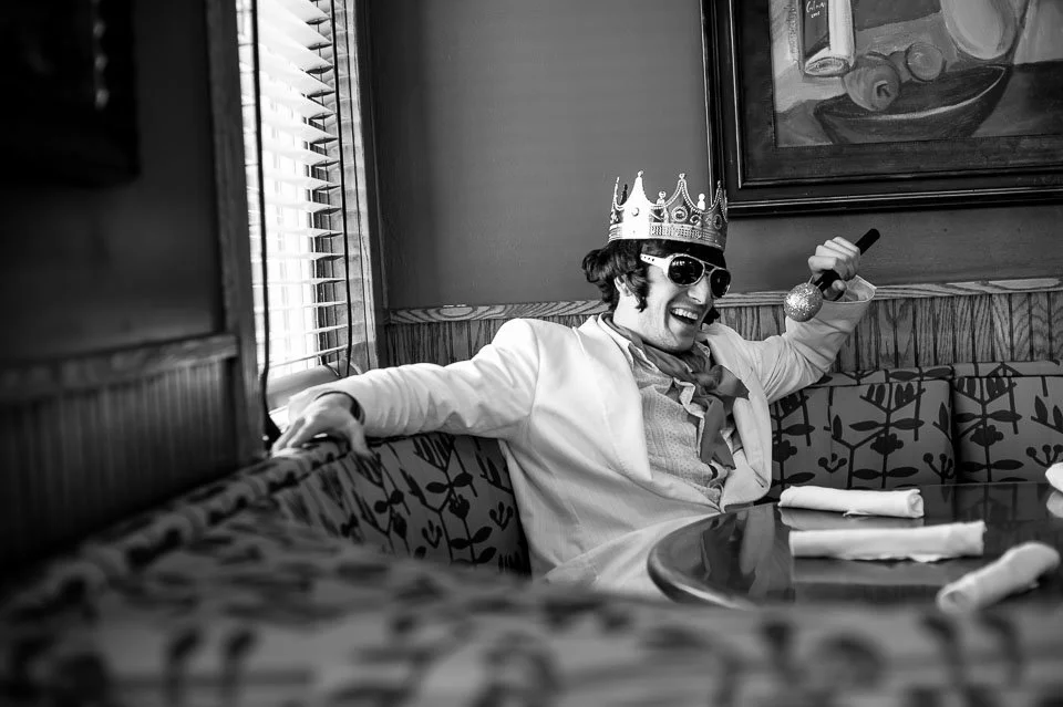 [32/100] ElvisWe went down to a local lake this weekend for a pond hockey tournament, kind of hockey's version of a Gus Macker basketball event. Freezing, we stopped in to Rose's for a bite to eat and some coffee. The table nearest the door was popul