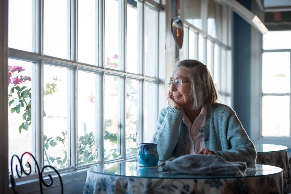 [38/100] Kitty - I met Kitty on Mackinac Island last weekend. We had finished photographing a wedding there and spent some time walking around on Sunday morning and stopped into a cute little coffee shop, the J L Beanery. Kitty was seated at this thi