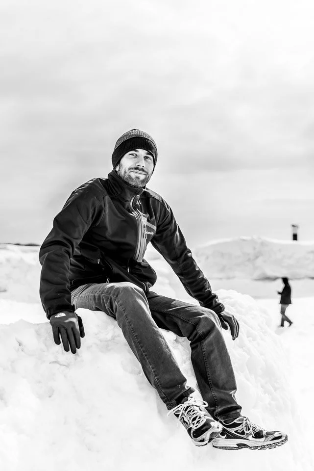 [34/100] Miguel - We went out to Holland, Michigan today to see the ice and enjoy the warming weather. Many others had the same idea. Miguel had braved the at times treacherous ice and had ascended one of the highest crests. I engaged him in a brief 
