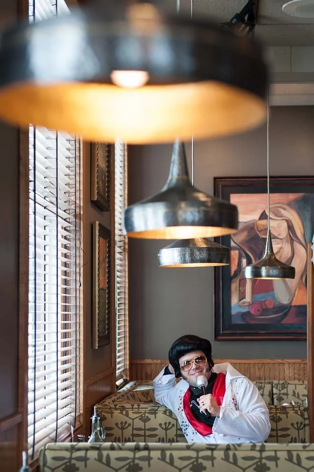 [33/100] Babcock Elvis - As mentioned for #32, "Elvis", we went down to a local lake for a pond hockey tournament. We stopped for a bite to eat. The table nearest the door was populated entirely by guys wearing Elvis costumes, their hockey team (the 