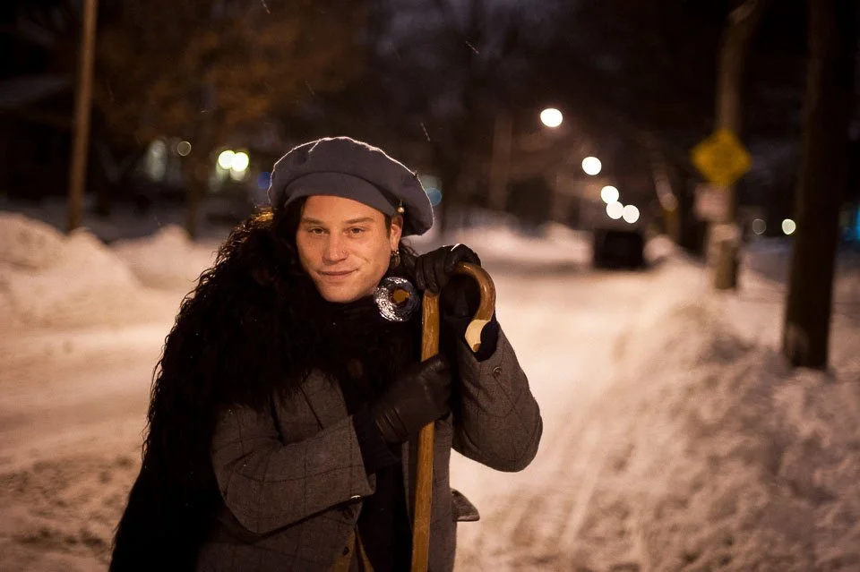 [36/100] Jesse - I noticed Jesse walking in front of me on a recent evening walk. The staff caught my eye and, soon after, the cloak. I caught up to him at a street corner and struck up a conversation. We shared several blocks' walk while chatting. I