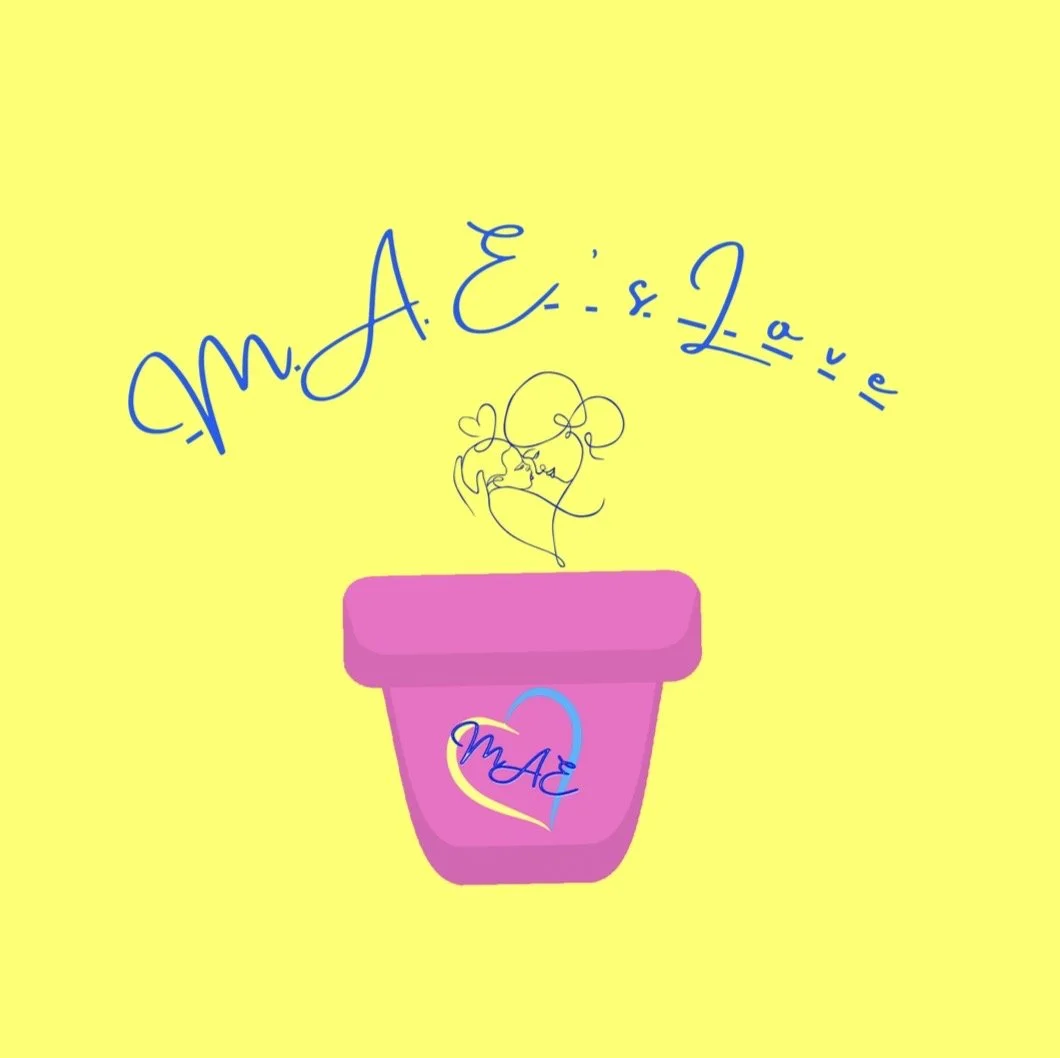 A pink flower pot with a colorful heart logo containing the text 'M. A. E.' on a yellow background. Above the pot, there is a handwritten-style text 'M. A. E. & La vie' and a simple line drawing of two faces close together, forming a heart.