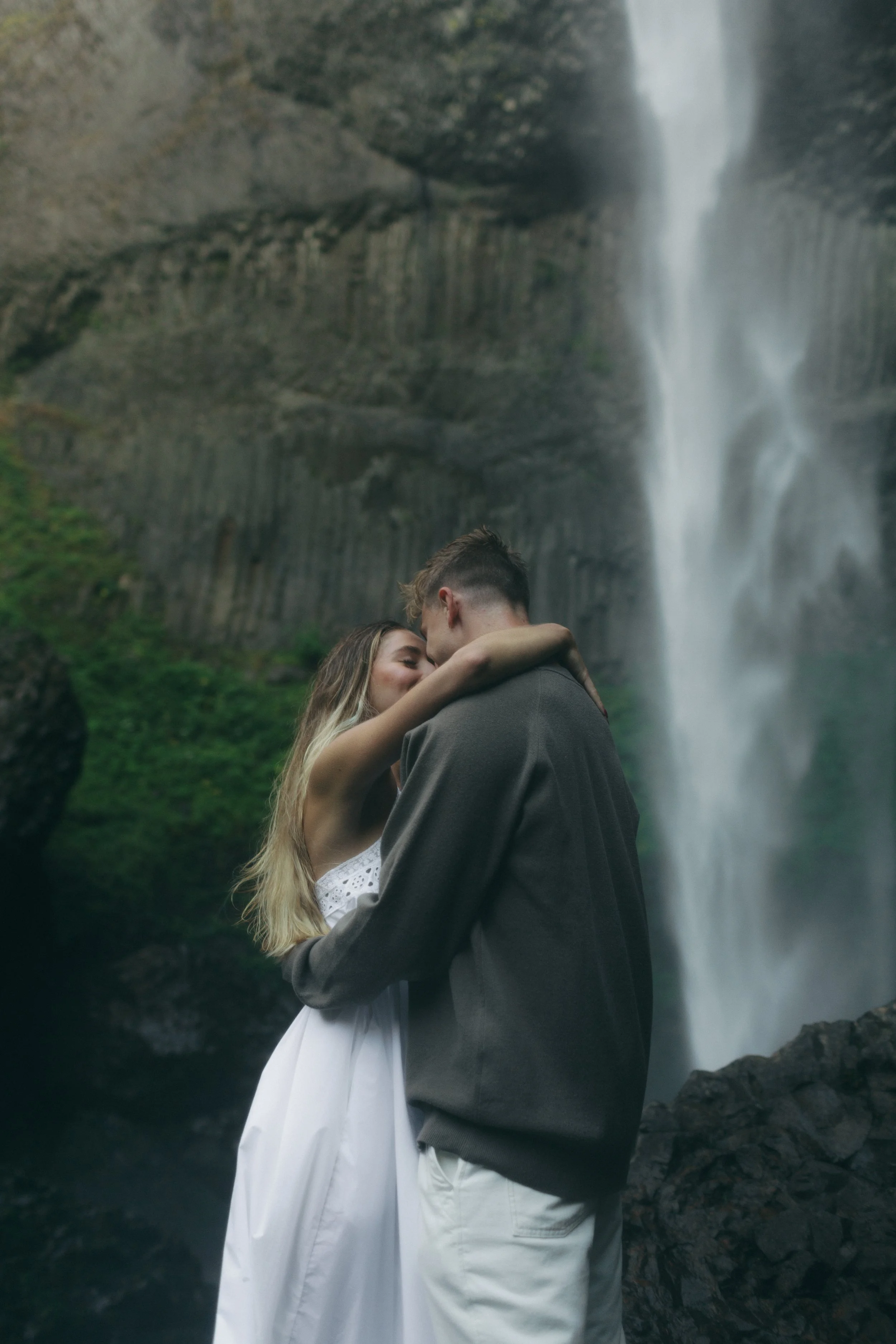 Cinematic, documentary style photographer. PNW, Seattle, Portland, Oregon elopement and couples photographer specializing in candid and dreamy photos. Waterfall engagement shoot. Oregon waterfall photoshoot photographer.