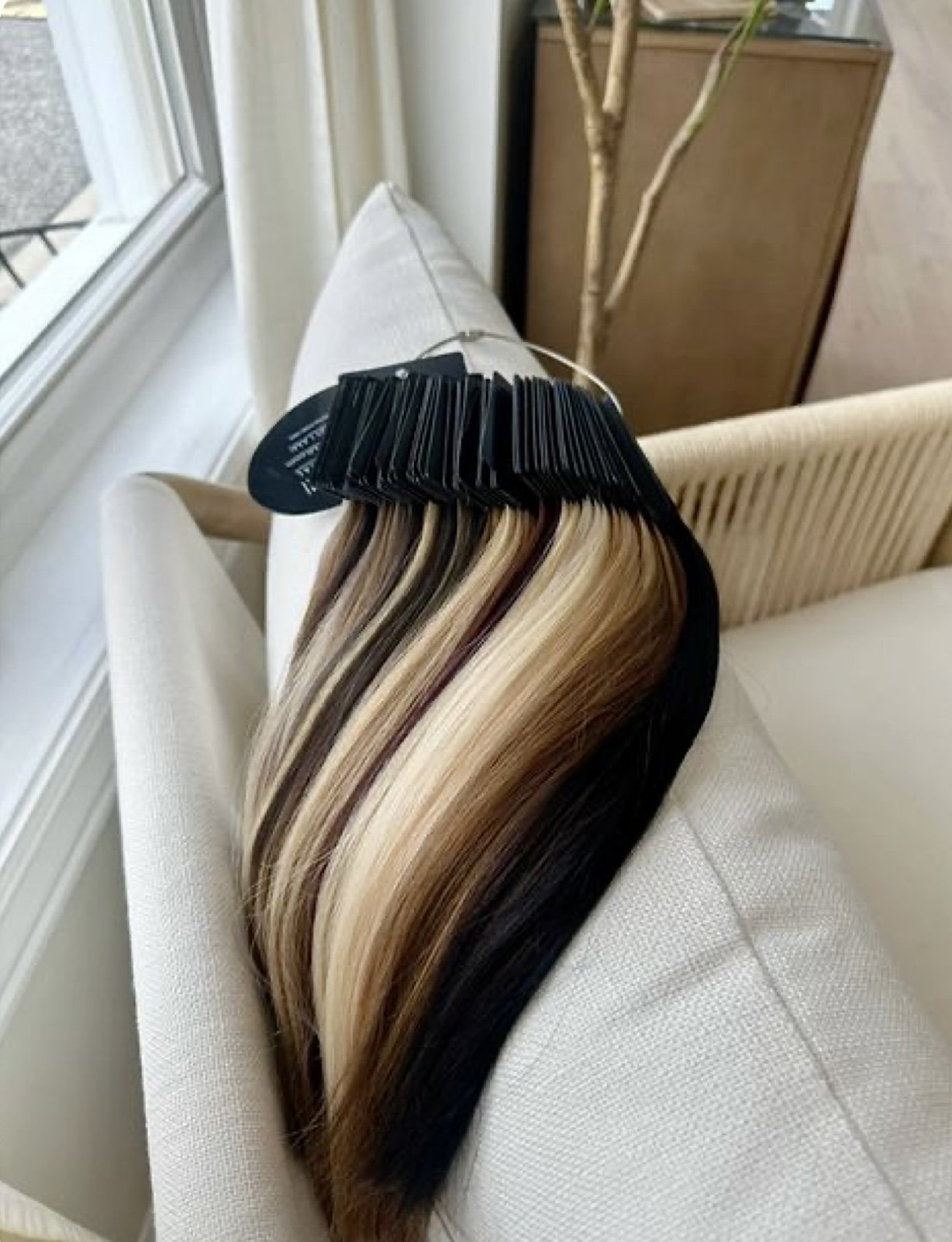 Hair extension color swatches used for custom color matching at Beauty By Kell Cart in Saint James, NY.