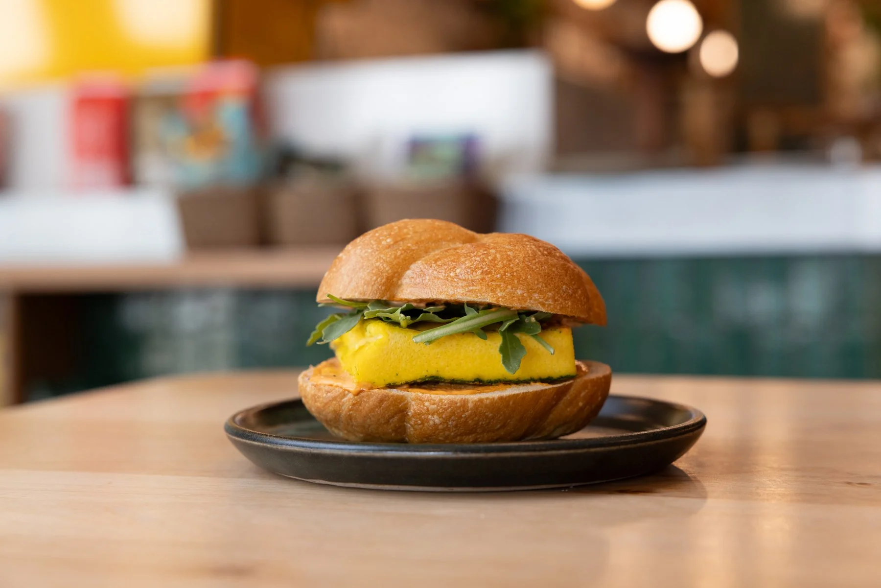 Fluffy egg patty, sharp cheddar, pickled red onions, arugula, piquillo-garlic aioli on a kaiser roll