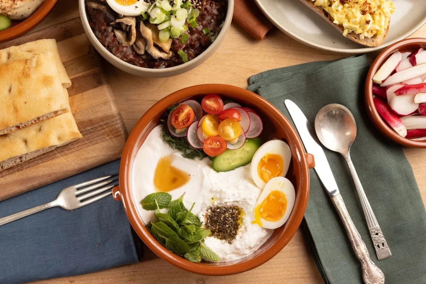 Persian breakfast bowl served with Acme's pizza bianca