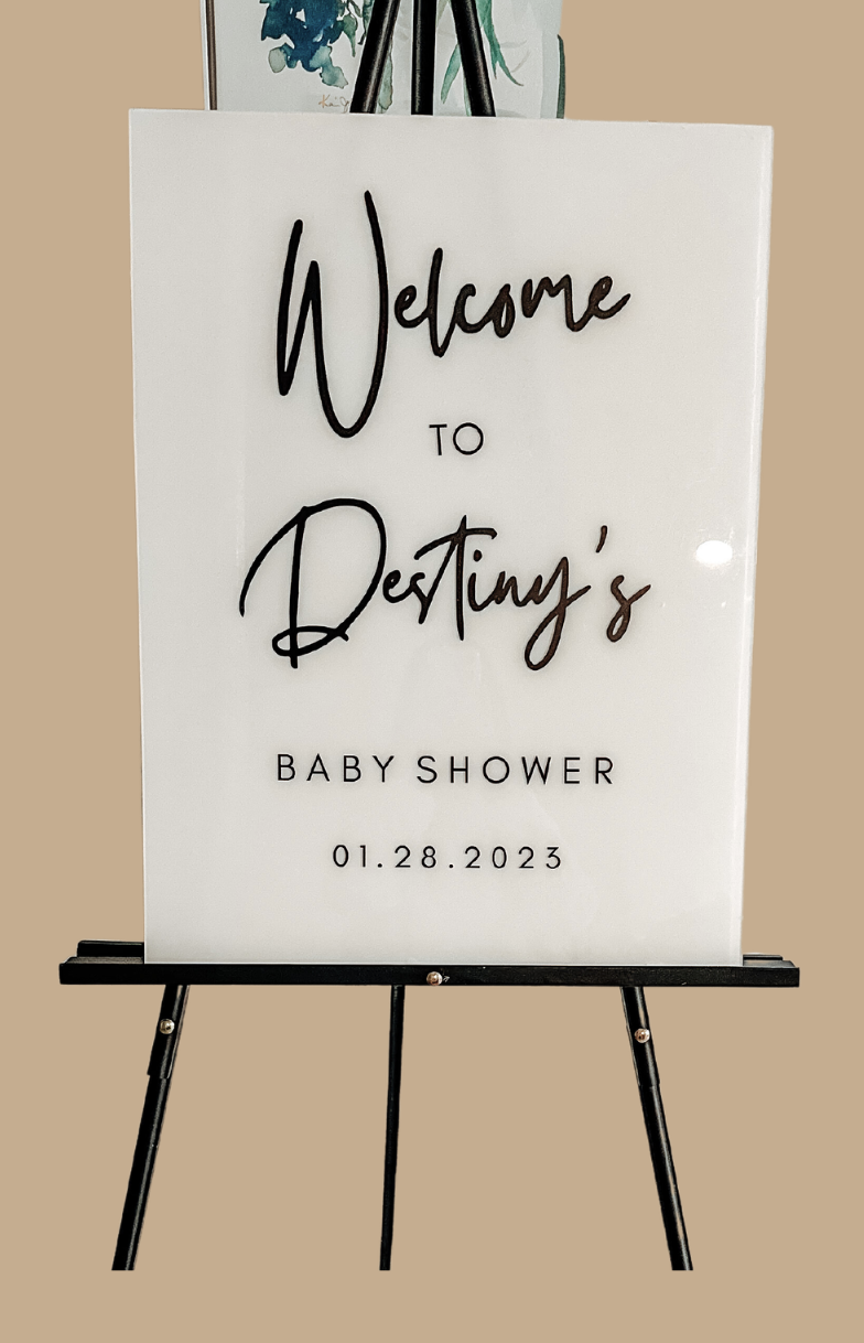 Welcome sign for Destiny's baby shower with date January 28, 2023, on a stand.