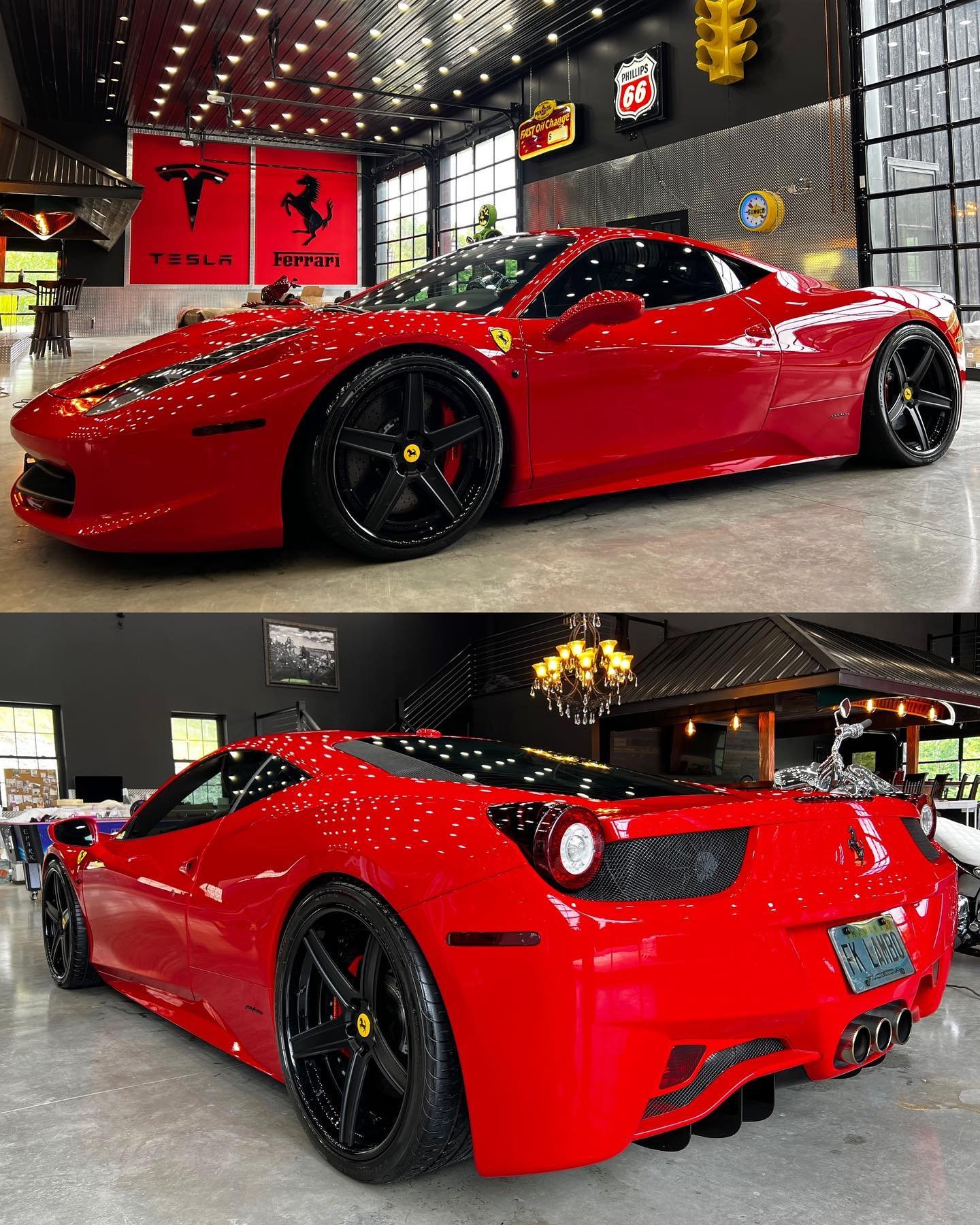 Two red Ferrari sports cars inside a showroom with vintage signs and memorabilia, one in the front and the other in the back, with black wheels and sleek design.