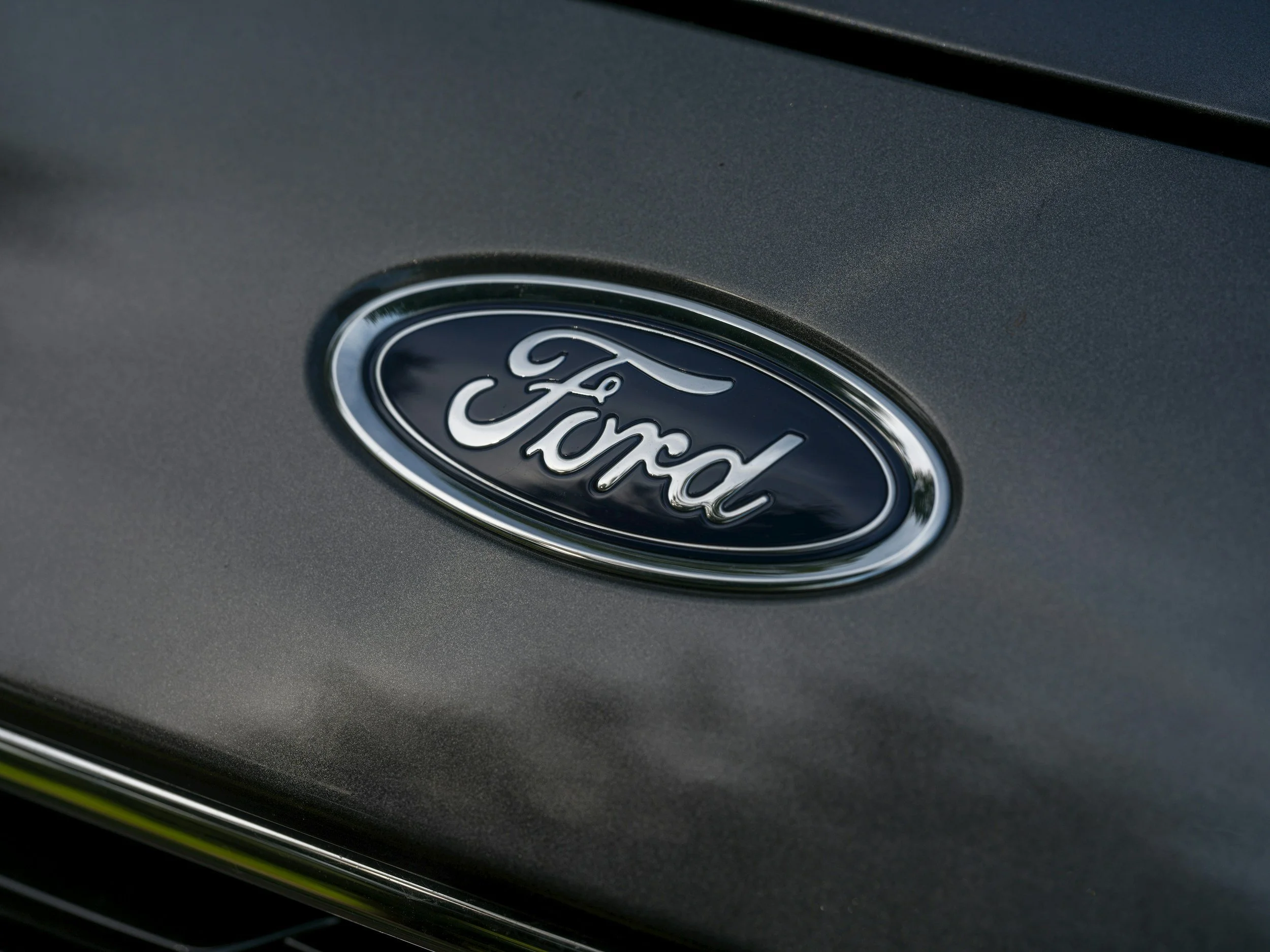 Ford vehicle emblem representing Ford specialist servicing