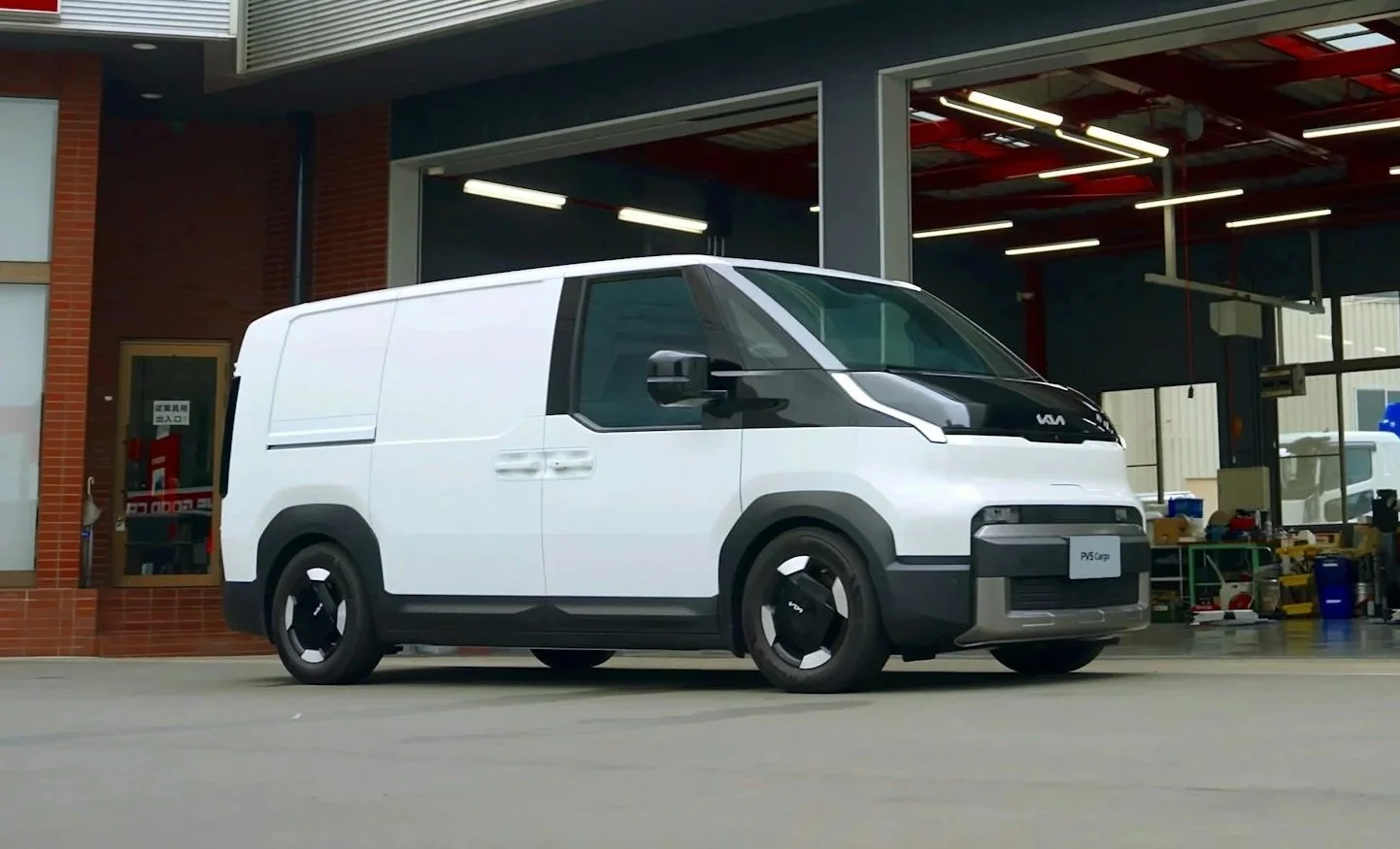 Commercial van servicing inside automotive workshop Fleet vehicle maintenance inspection Ute servicing for business fleet vehicles Scheduled fleet servicing in progress