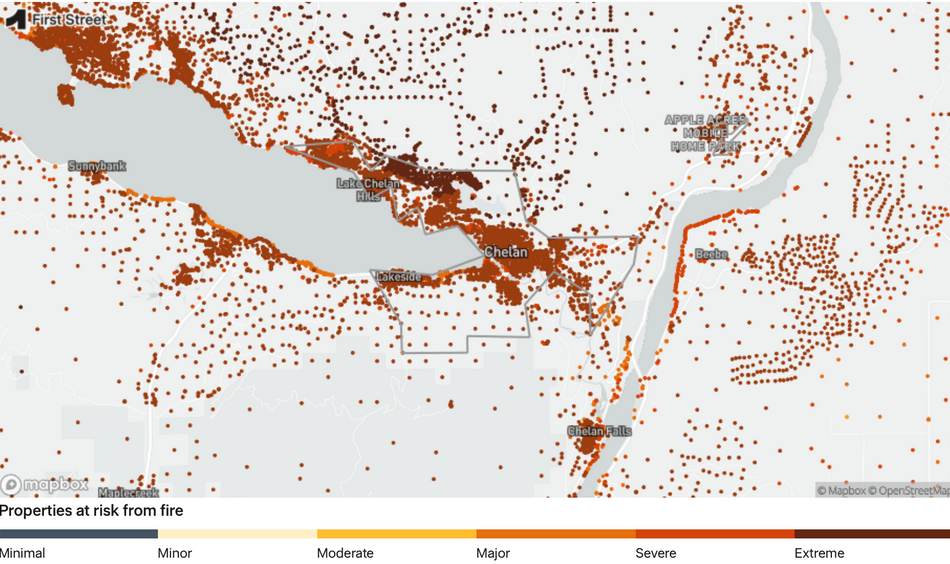 A map showing properties at risk from fire around Lake Chelan, including areas like Sunnybank, Lakeside, Chelan, and Chelan Falls. The map uses a color gradient from minimal to extreme risk, with most of the risk markers in orange and red.