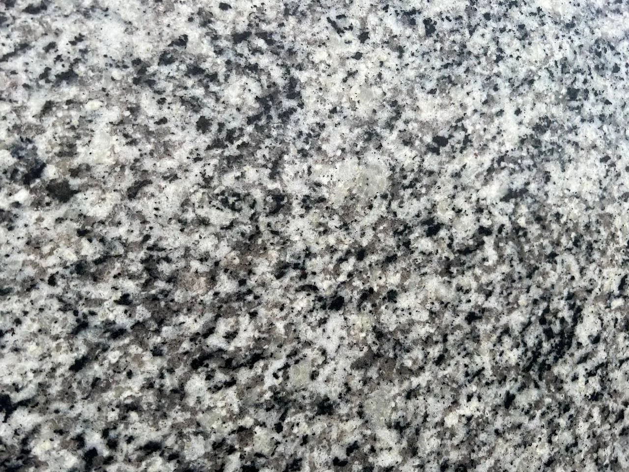 Granito Valle Granite. A Close-up of a speckled granite surface.