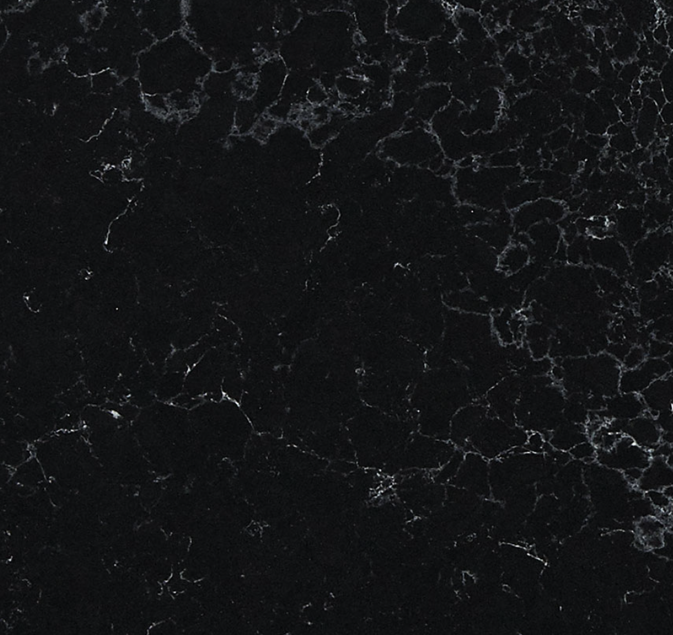 Midnight Corvo Quartz. A Black marble texture with white veining.