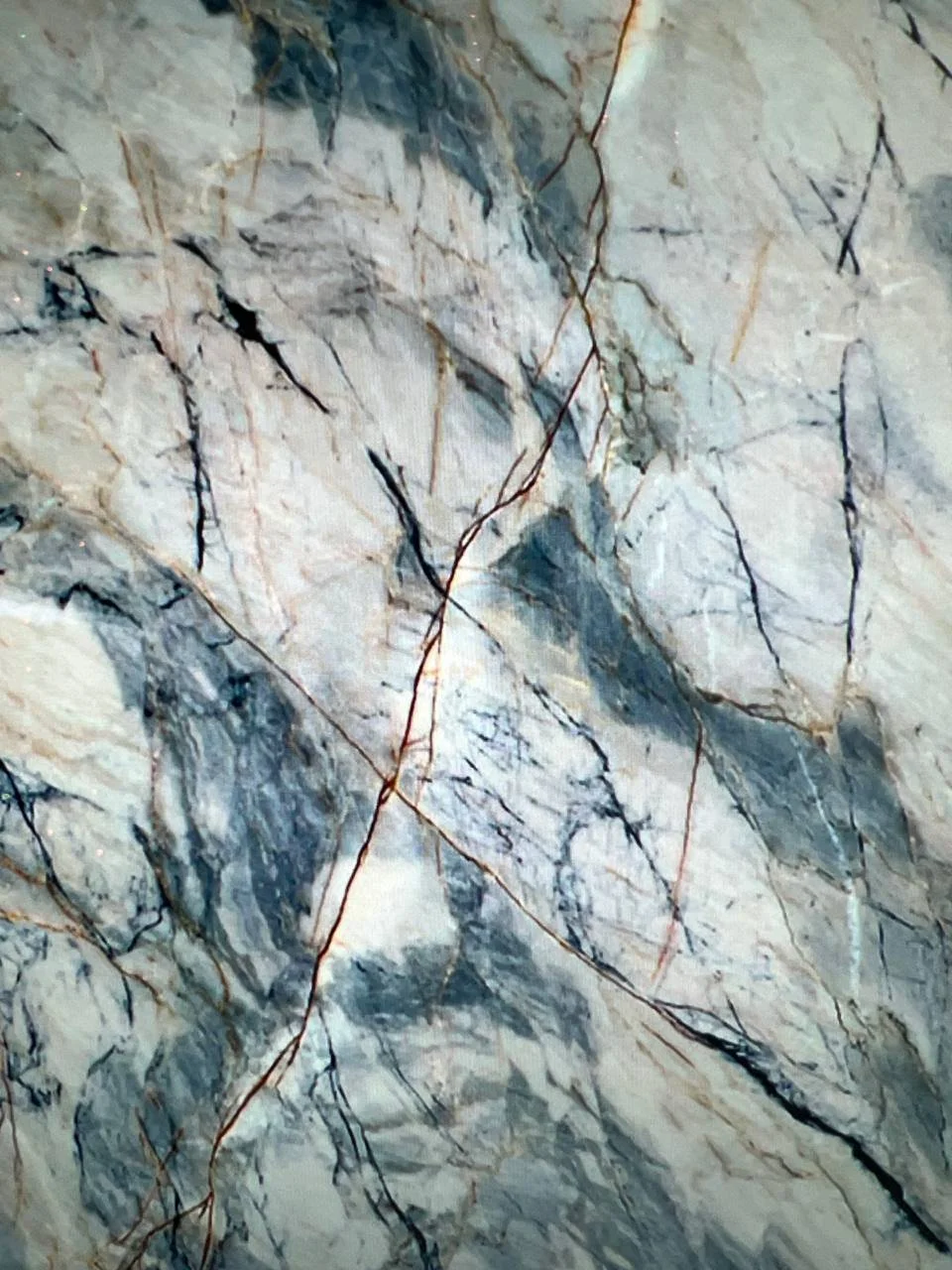 Close-up of marble surface with gray and white veins