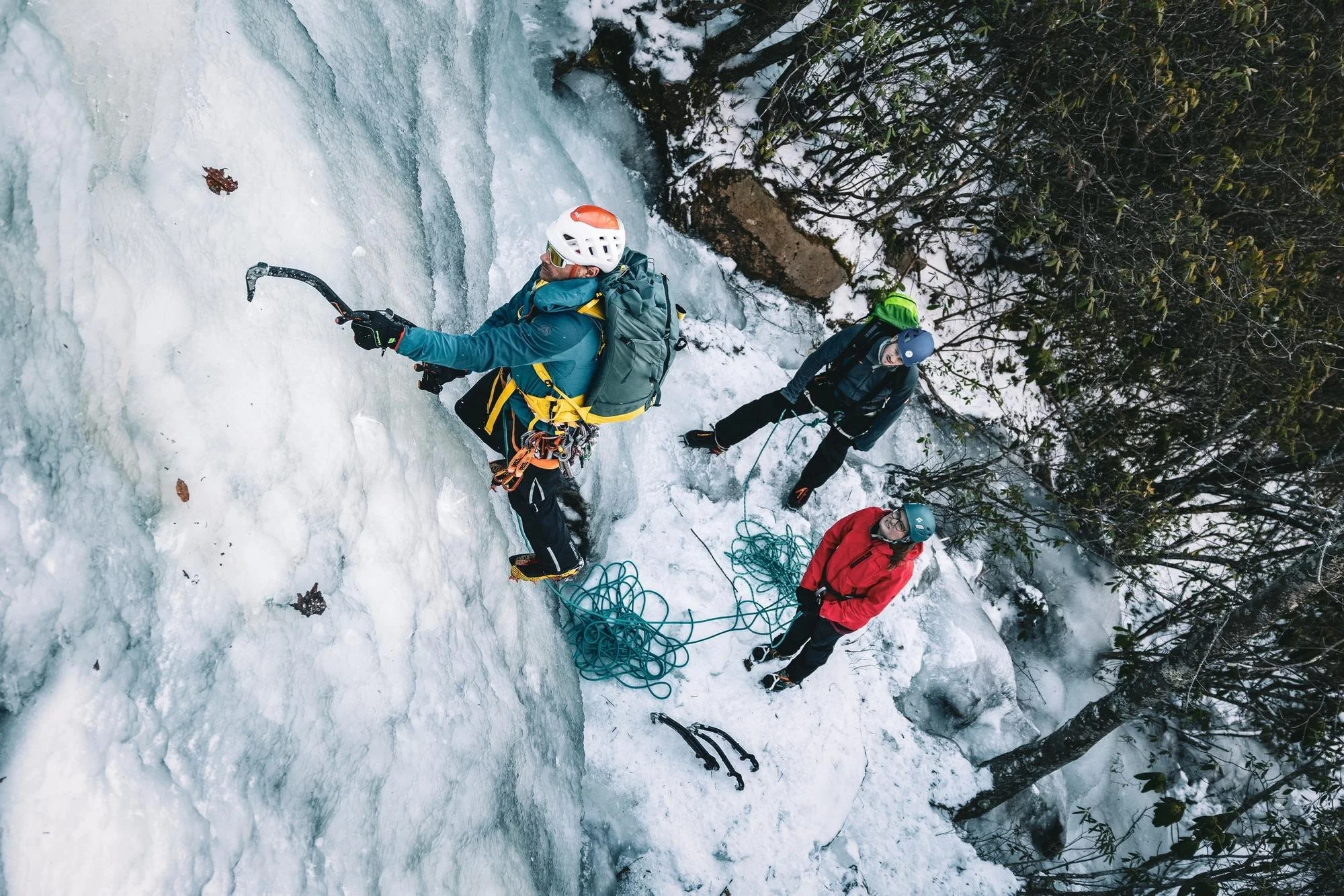 IFMGA guide Karsten Delap leading ice at Sam’s Knob while two clients watch from the base, Western North Carolina