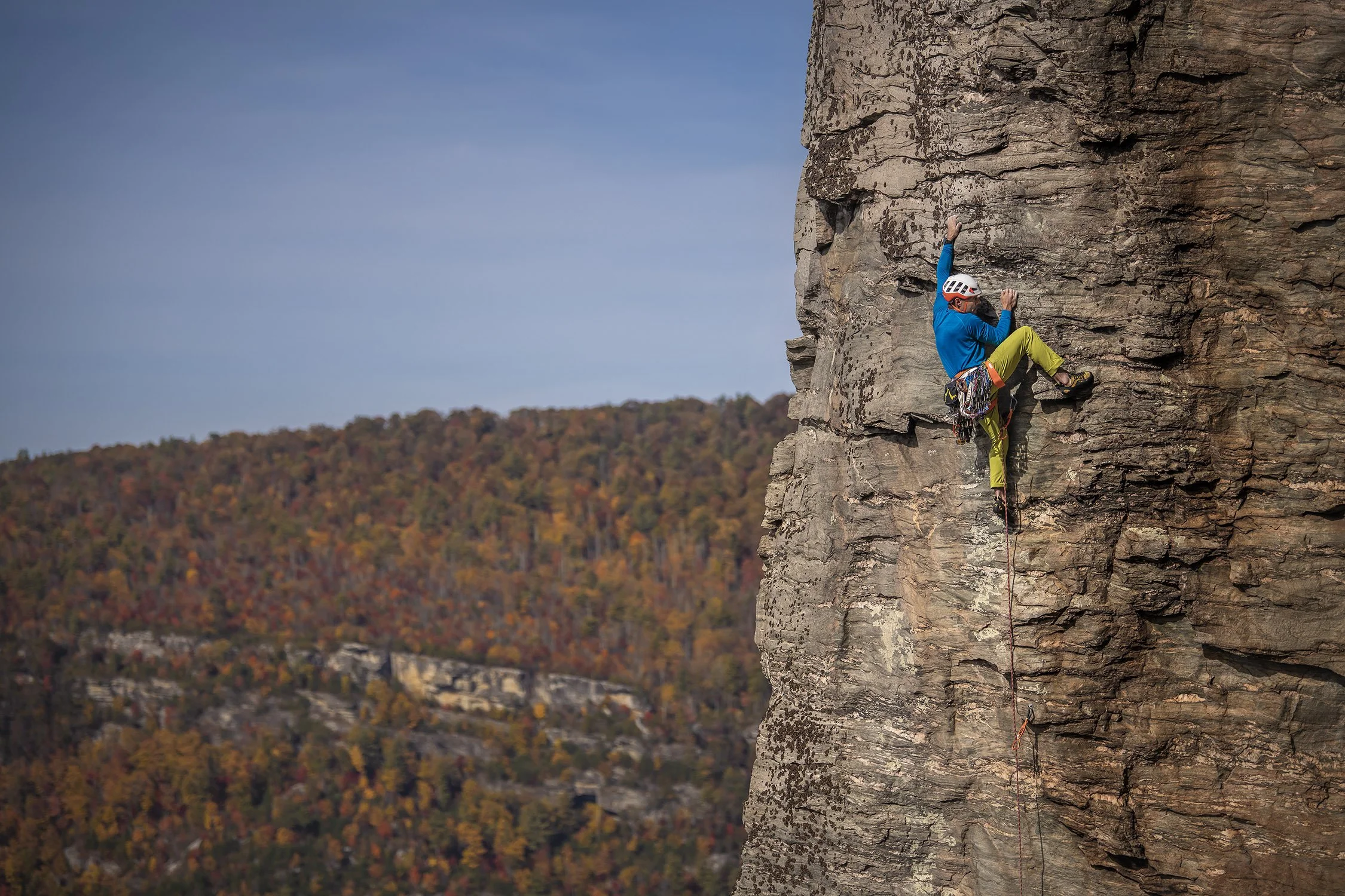 linville gorge in the fall colors with a climber