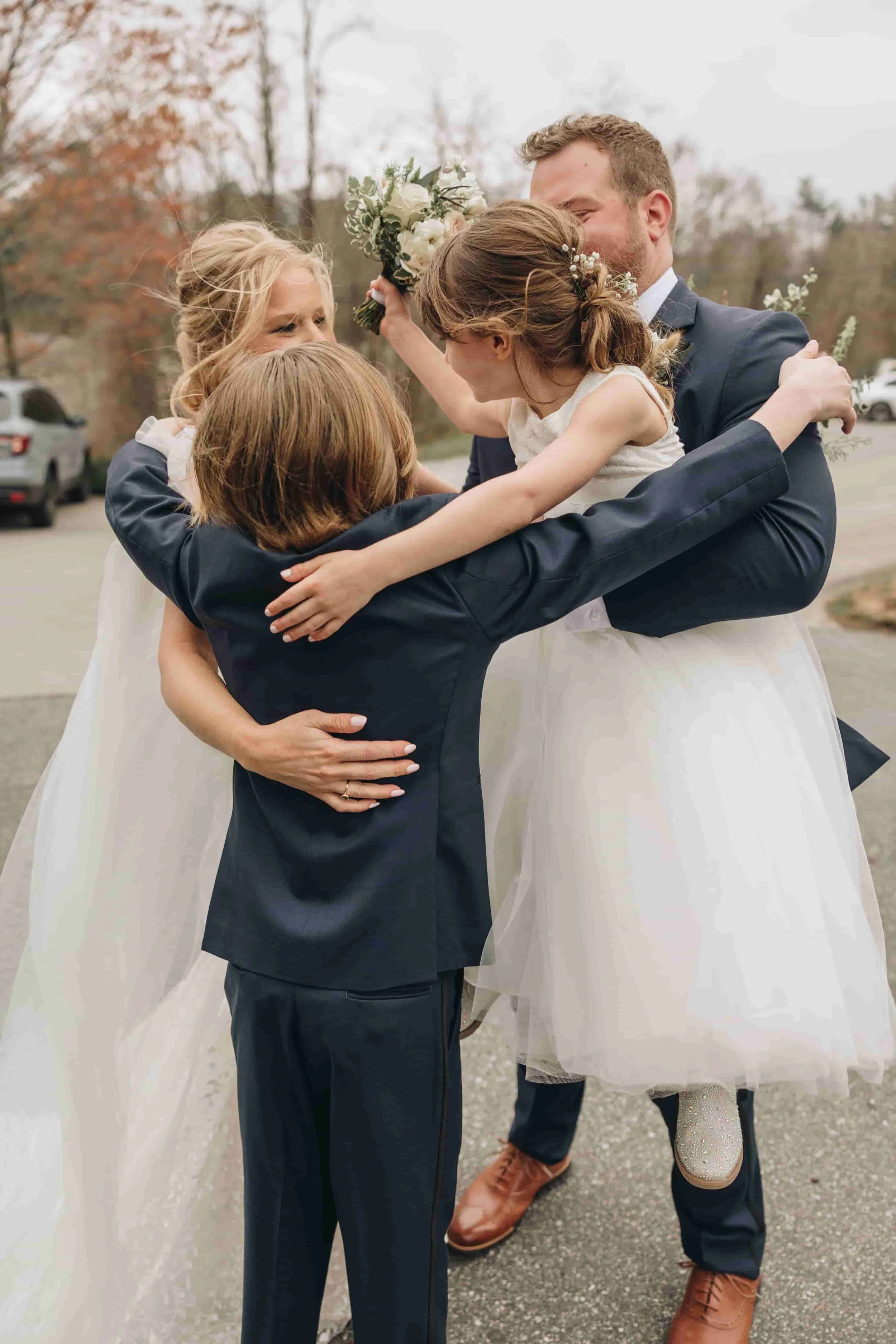 Bride and Groom holding their kids