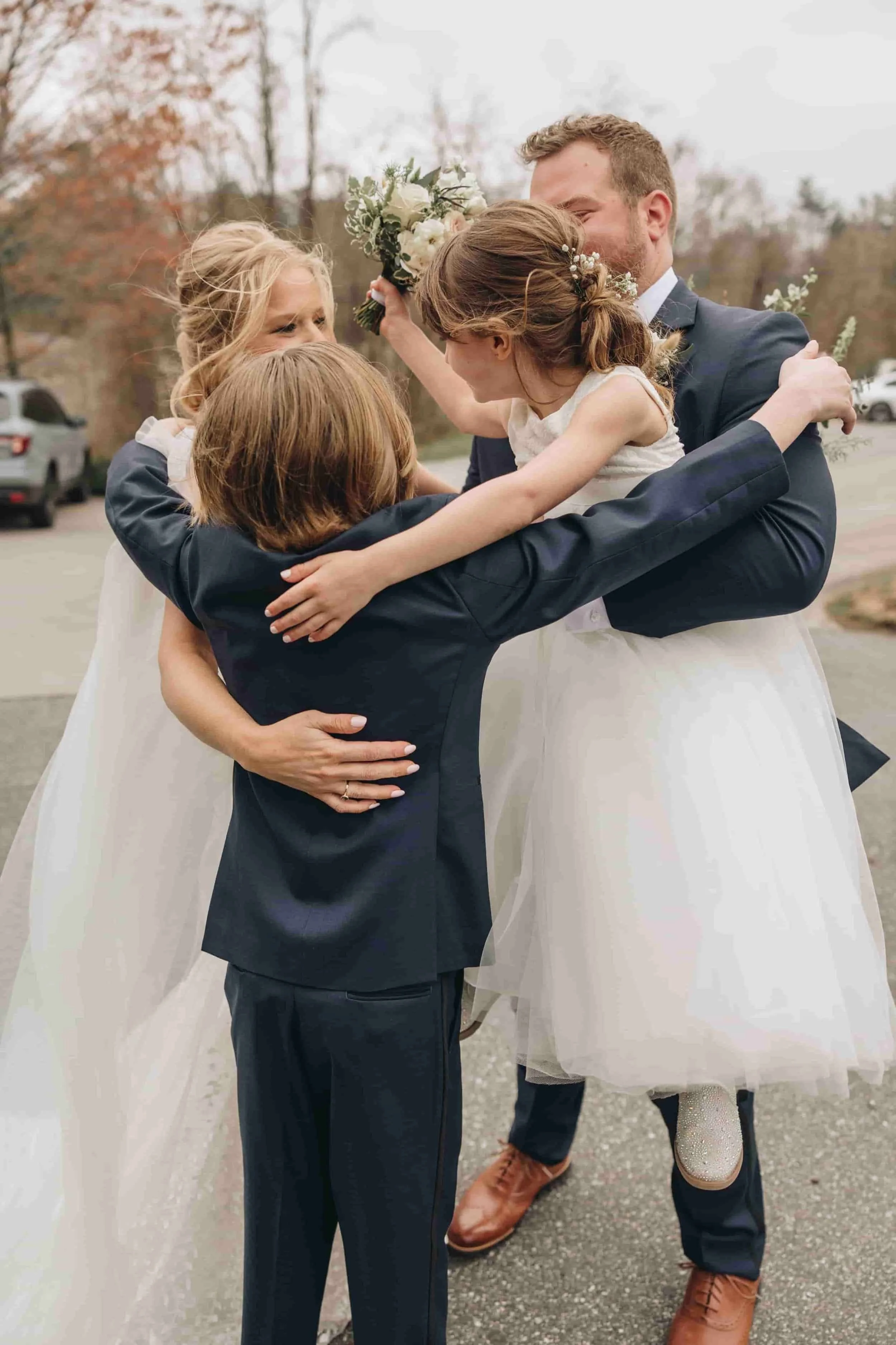 Bride and Groom holding their kids
