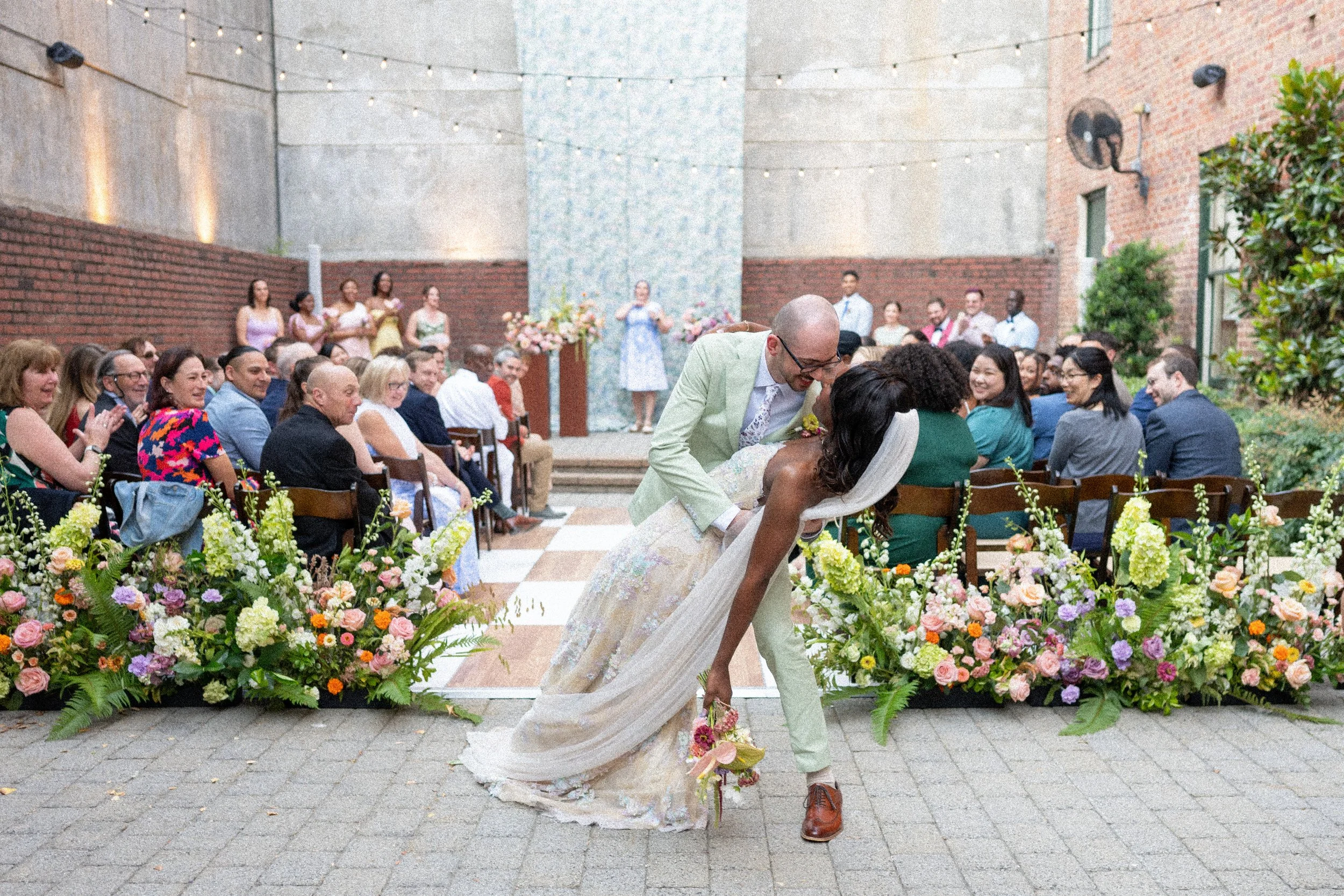 End of the wedding aisle dip, raleigh, interracial couple