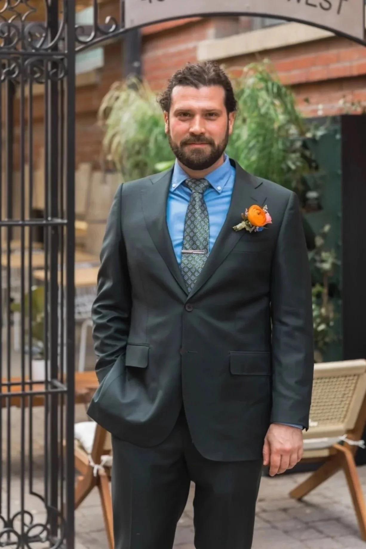 Jack dressed in a green suit for his wedding, styled by Sham.