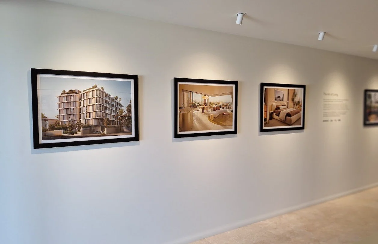 Series of architectural renders in professional gallery frames, installed in a Gold Coast sales suite.