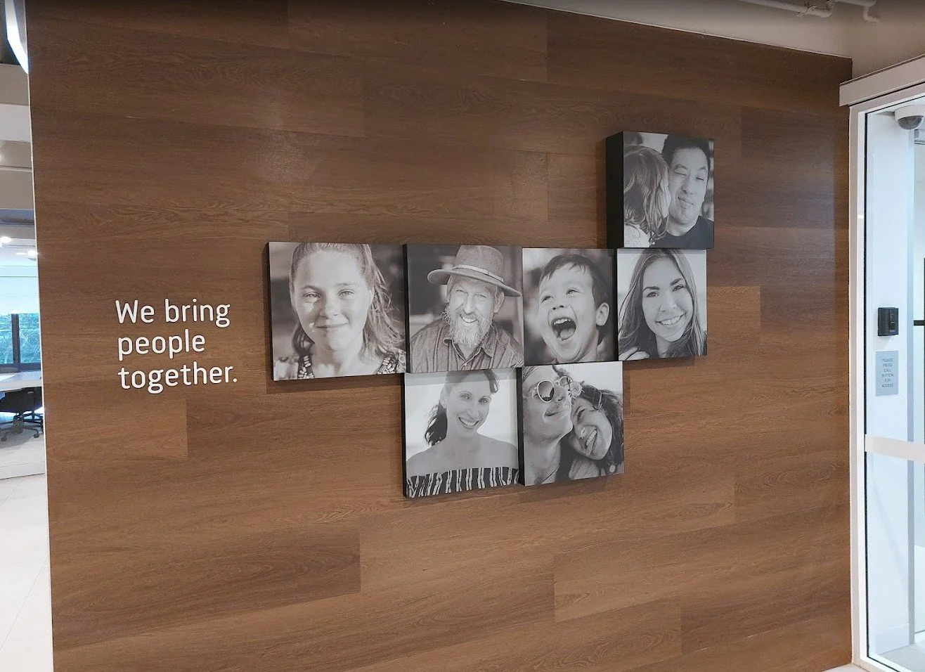 Multi-panel photographic wall display professionally printed and installed behind a Brisbane reception desk