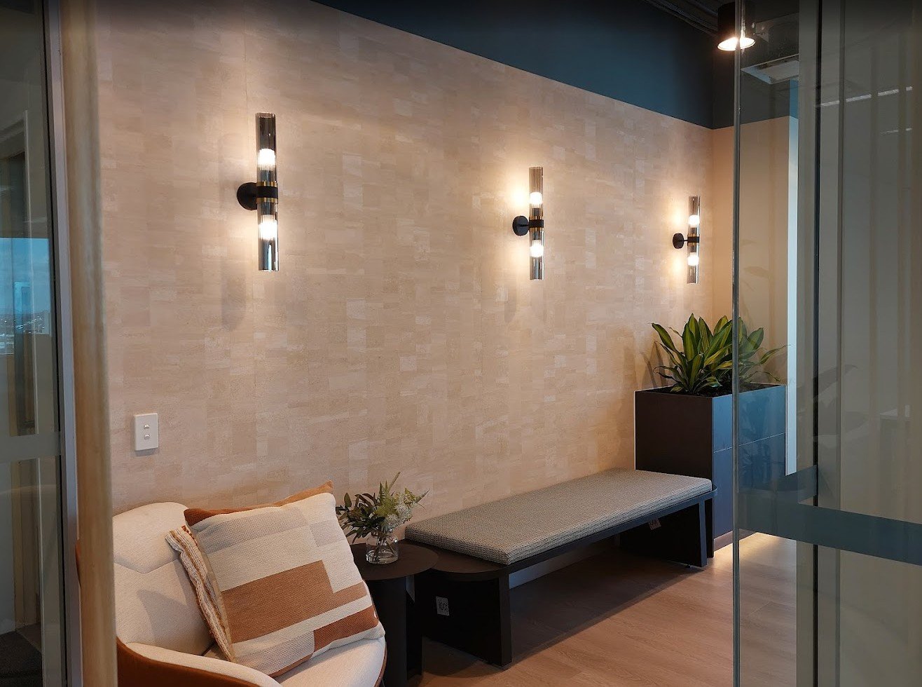 High-end cork-textured architectural wallpaper installation for a professional office feature wall.