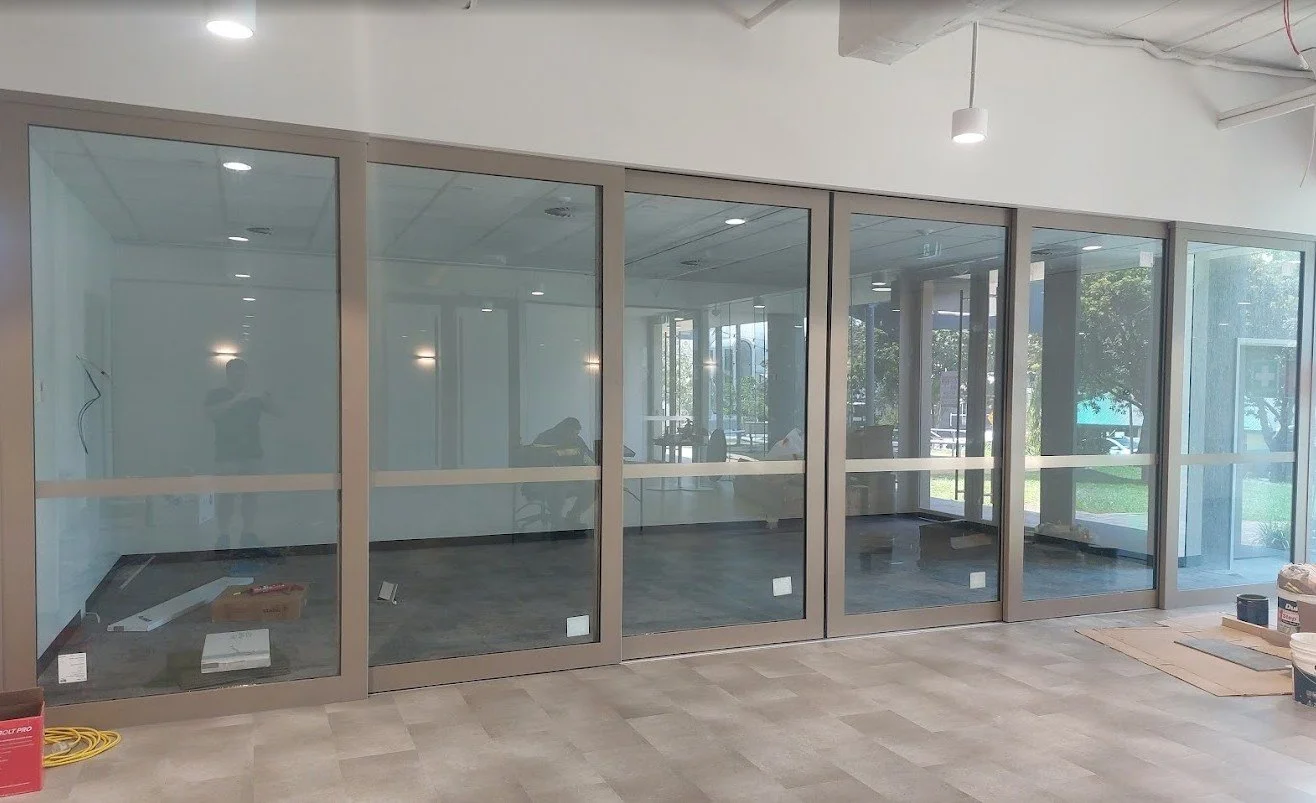 Frosted glass compliance bands with a champagne finish for office safety and visibility in Brisbane.