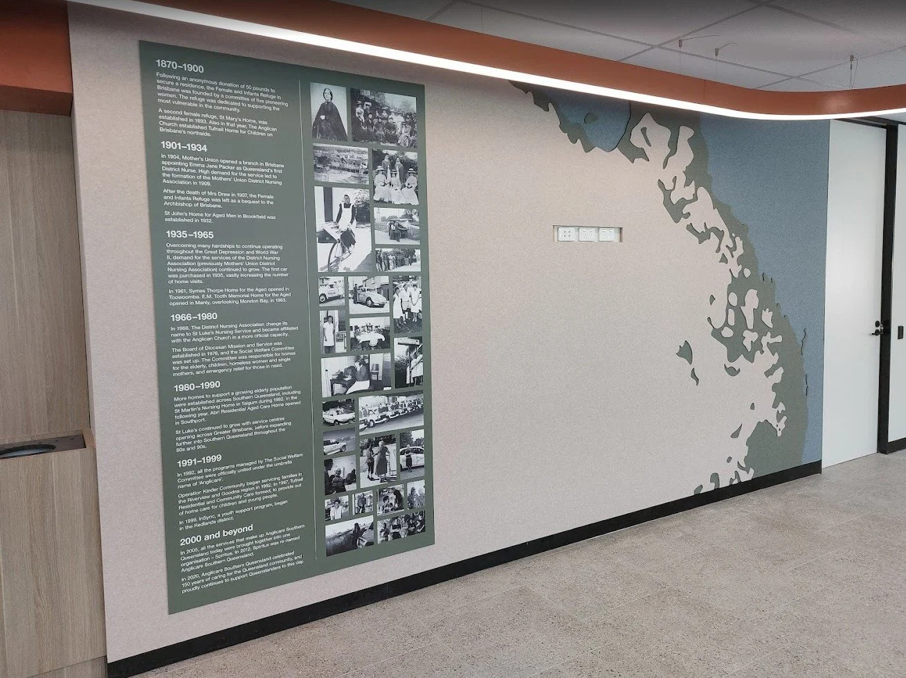 Custom laser-cut acoustic wall panel with printed map design for sound dampening and office branding.
