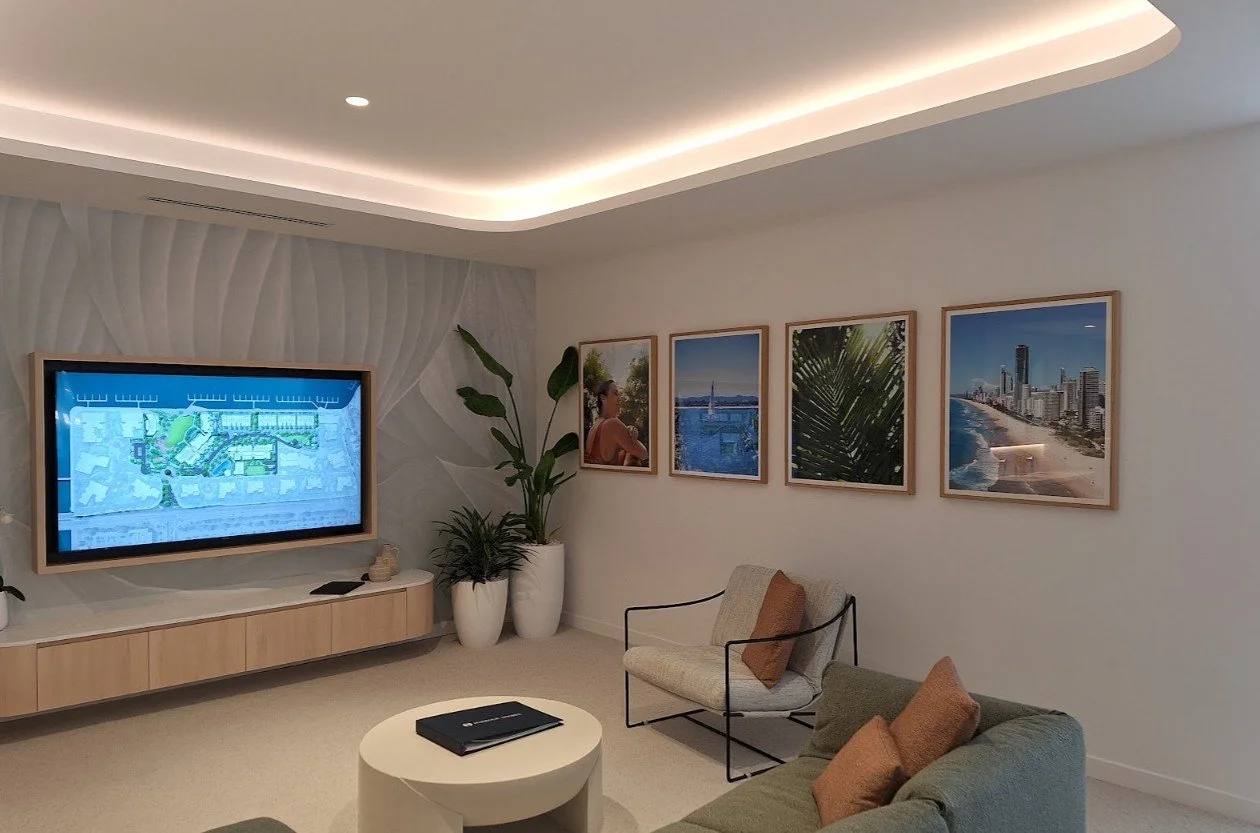 Collection of four professional colour photo prints in custom oak frames, installed in a modern break area.