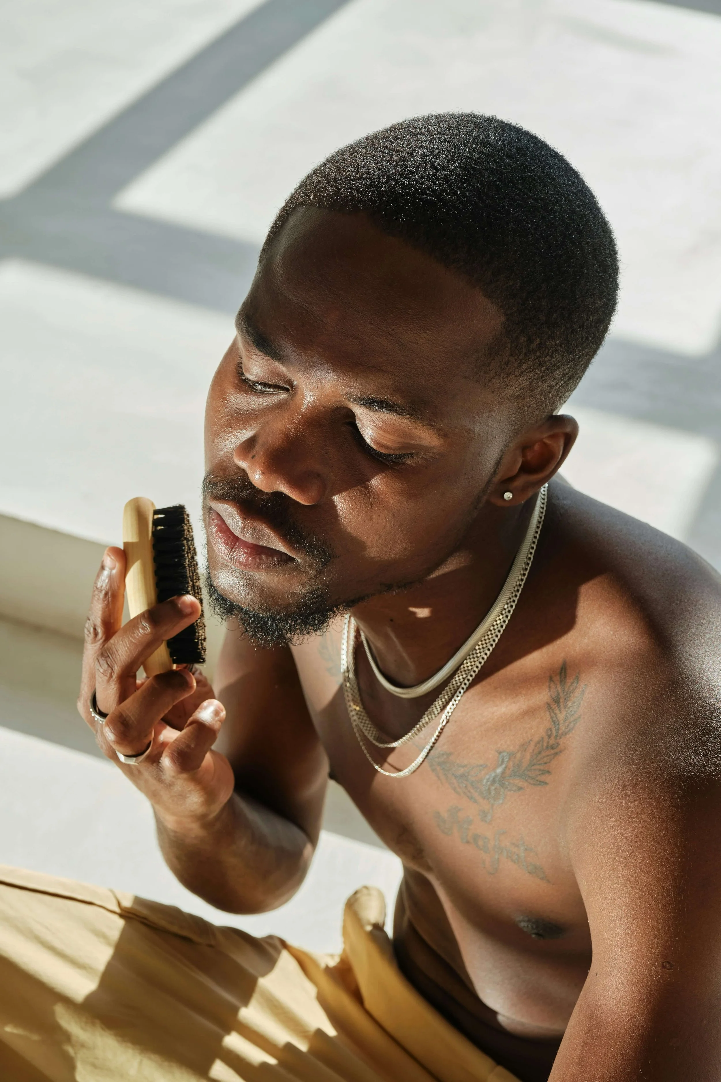 Male using a grooming product on his face  Credit: Andrej Lišakov - Unsplash