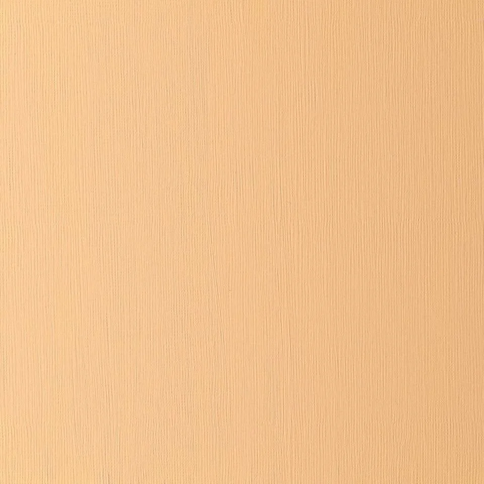 Close-up of a textured peach-colored wall.