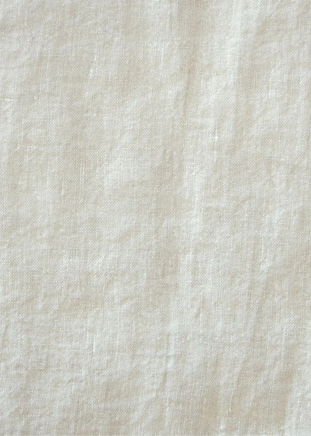 Close-up of a beige fabric texture.