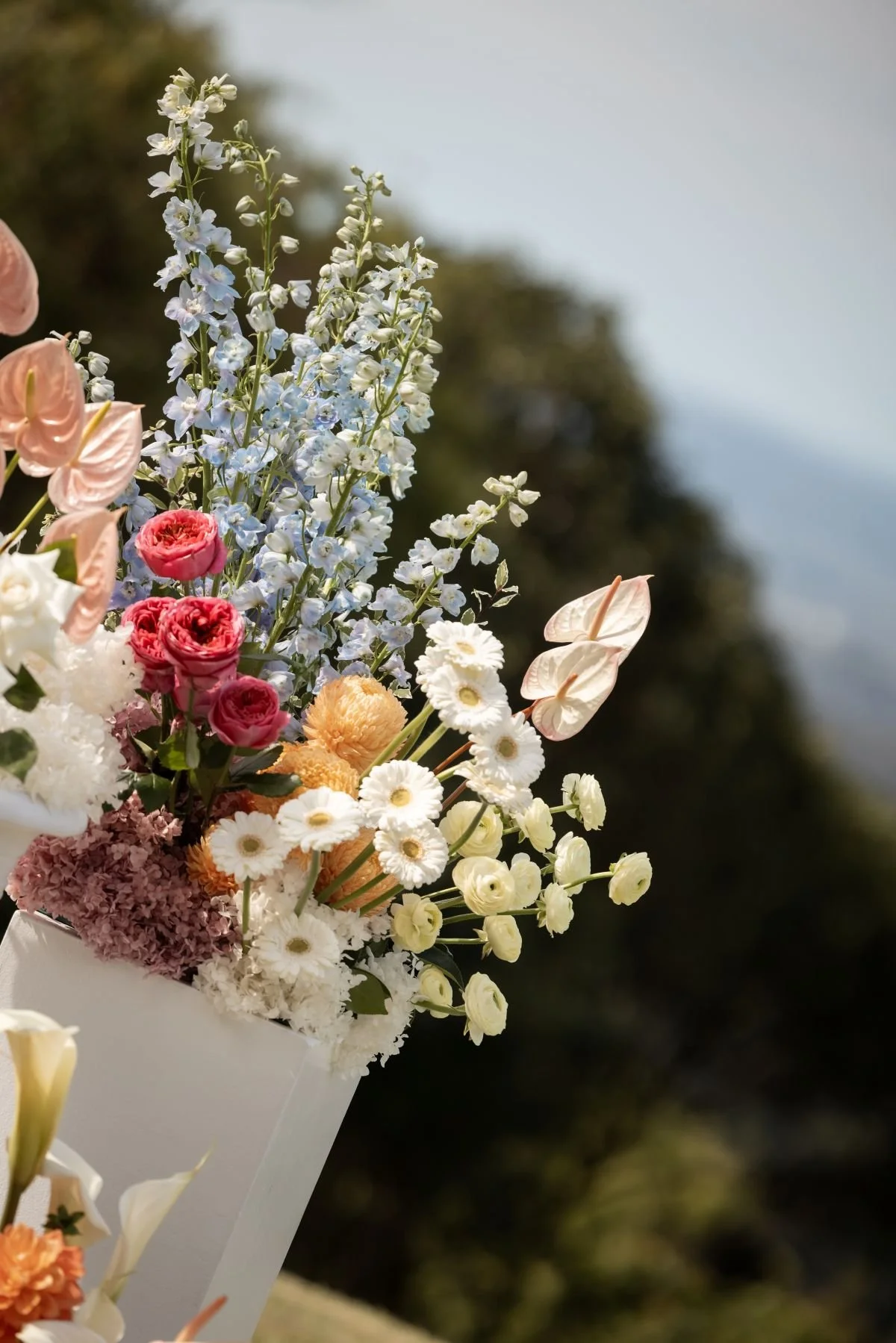 Wedding Ceremony Florals Designs on white plinths