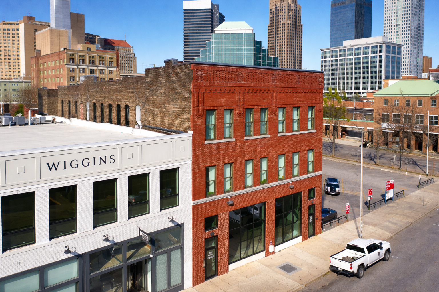 Downtown buildings under a clear sky.png