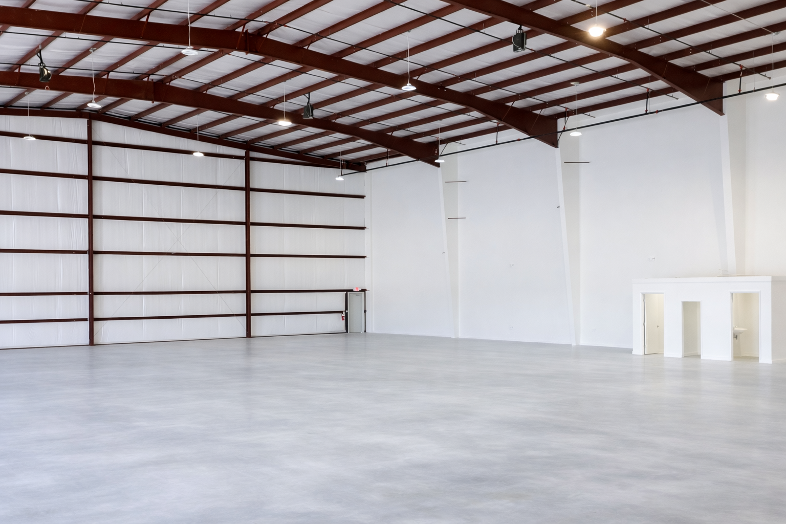 Spacious industrial warehouse interior.png