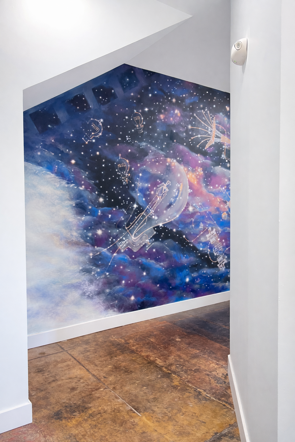 Cosmic mural under angled ceiling.png