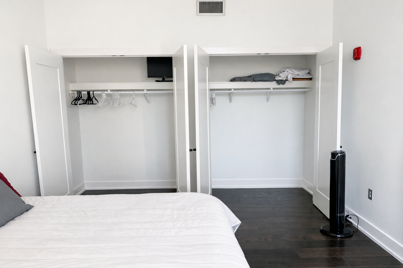 Modern bedroom with open closets.png