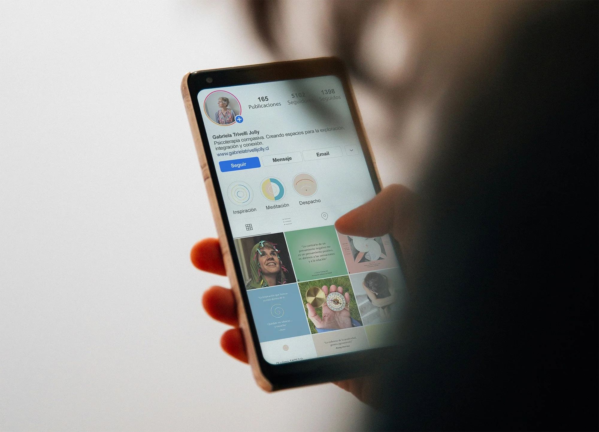 hand holding smartphone mockup.jpg