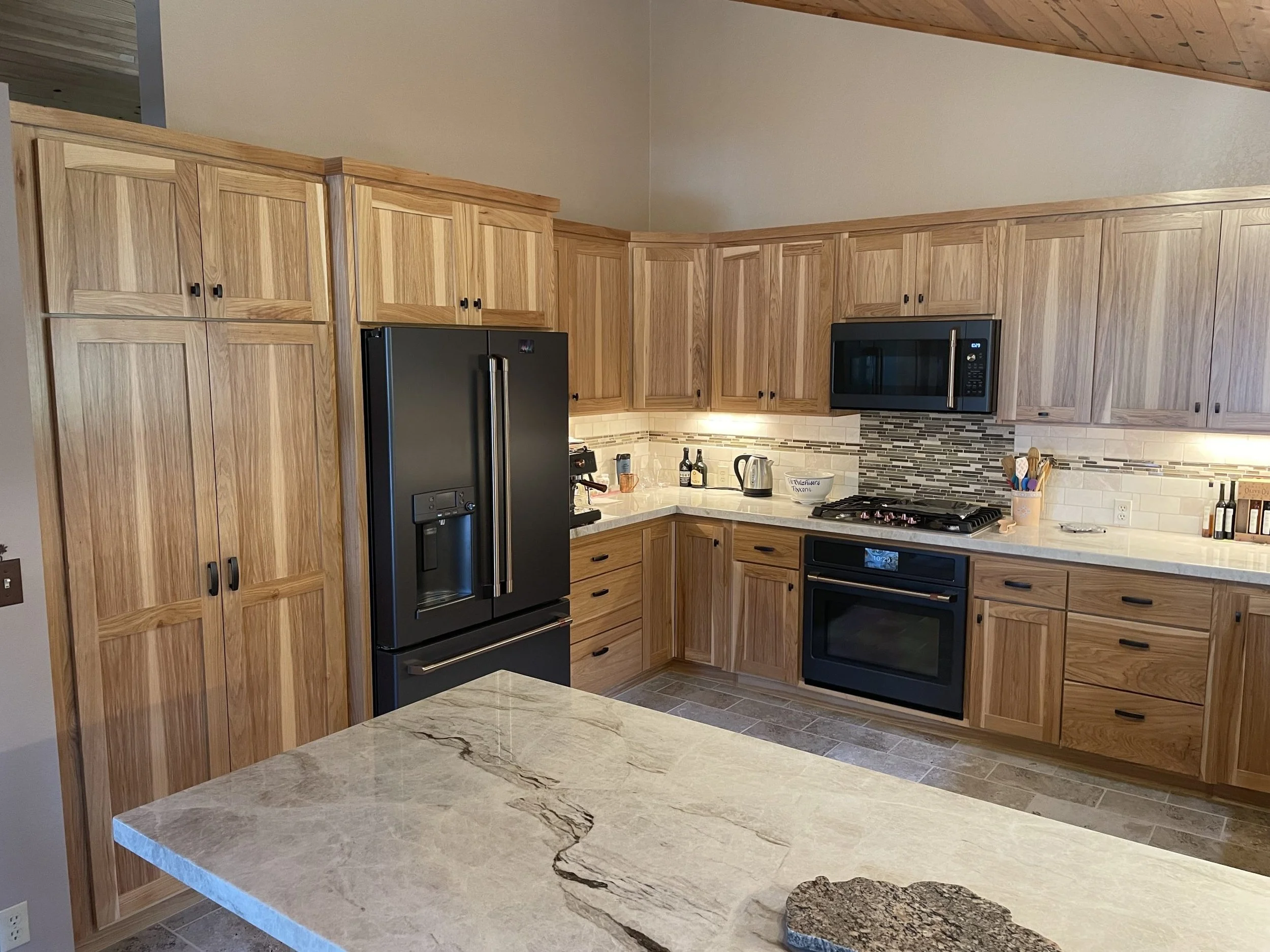 Custom carpentry cabinets are showcased in a newly remodeled kitchen