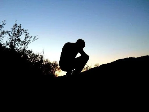 Man sitting on a hill